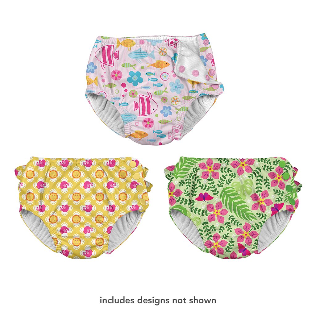 Three different swim diapers that one shows a girly school of fish pattern, the other is a sun and bird pattern, and the last one is a tropical flower pattern. At the bottom is says "includes designs not shown".