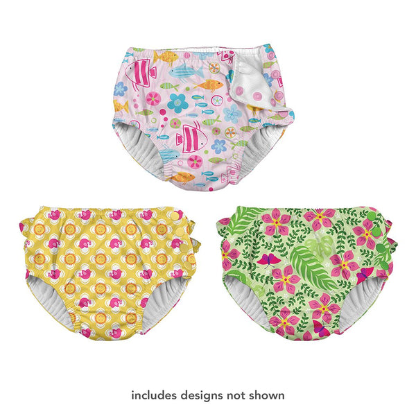 Three different swim diapers that one shows a girly school of fish pattern, the other is a sun and bird pattern, and the last one is a tropical flower pattern. At the bottom is says "includes designs not shown".