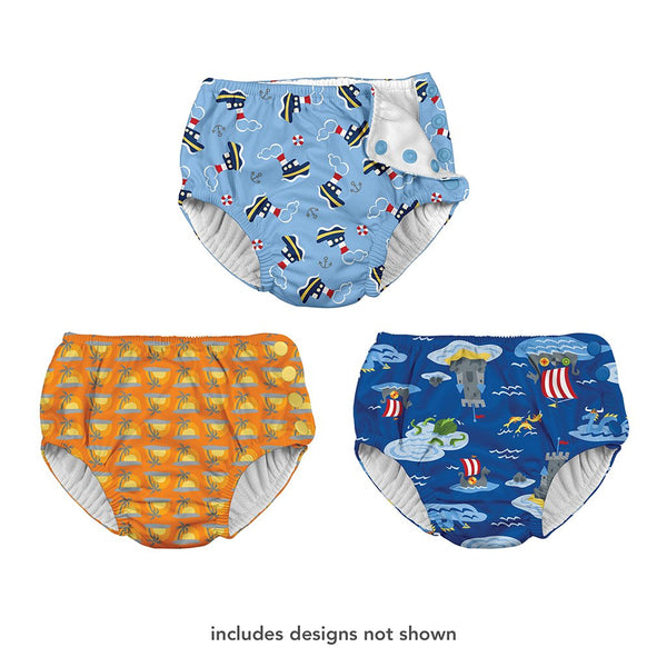 Three different swim diapers that one shows a tug boat pattern, the other is a cartoon sunset, and the last one is a castle with a viking boat pattern. At the bottom is says "includes designs not shown".